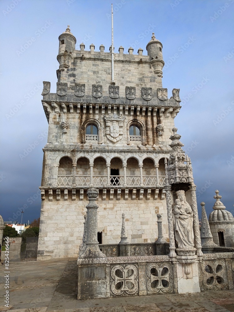 an ornate building with statues on the outside and in front of it