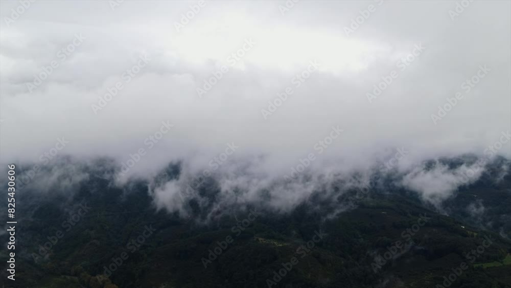 Aerial timelapse of clouds rising over green mountains and houses in Kuzuluk town in Bolu, Turkey Aerial timelapse of clouds rising over green mountains and houses in Kuzuluk town in Bolu, Turkey