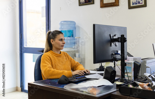 An office worker at her desk photo