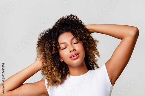  Cool and relaxed woman with textured curls photo