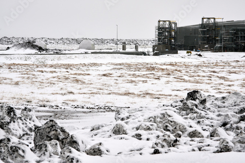 Carbon capture and storage - dirty snow near construction photo