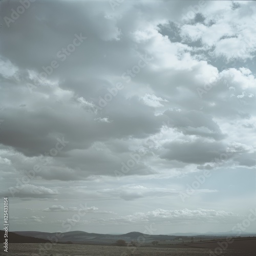 Photograph of an atmospheric perspective with dark grey clouds 