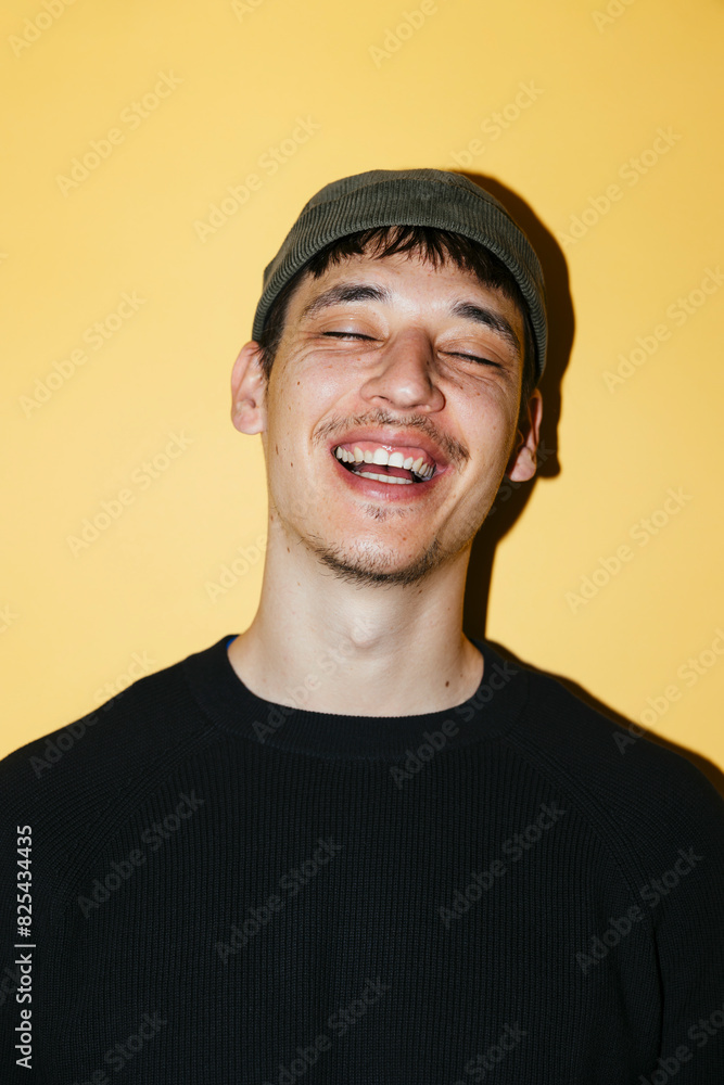 Smiling man in yellow wall ugc Smiling man in yellow wall ugc