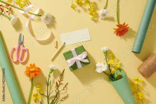 Holiday greetings card with colorful flowers on yellow background photo