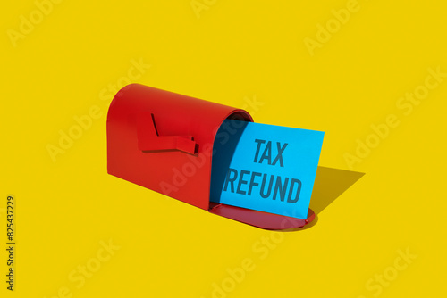 envelope with the text tax refund in a mailbox photo