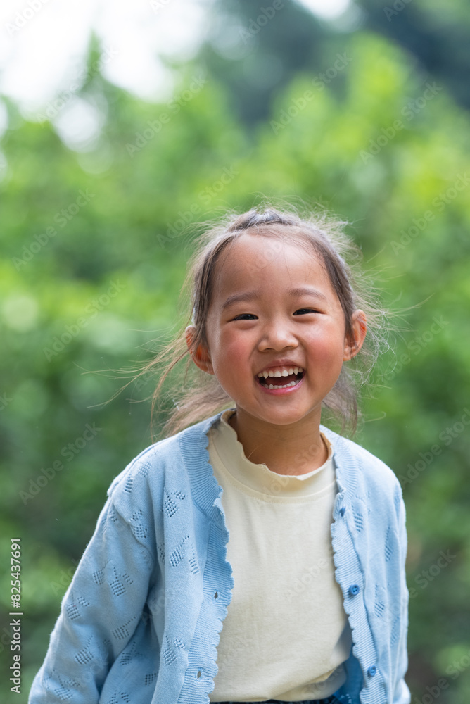 portrait of happy little asian girl laugh in the spring park portrait of happy little asian girl laugh in the spring park