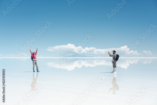 couple taking picture of their trip photo