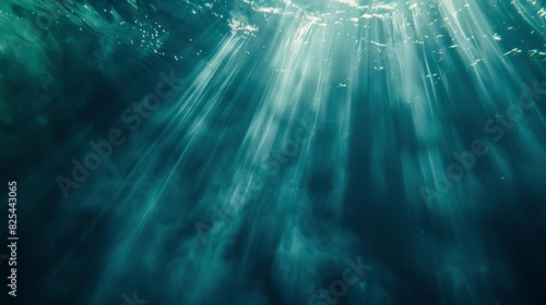 ethereal underwater light rays piercing through depths abstract aquatic background