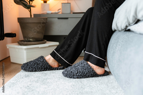 Women's feet in slippers photo