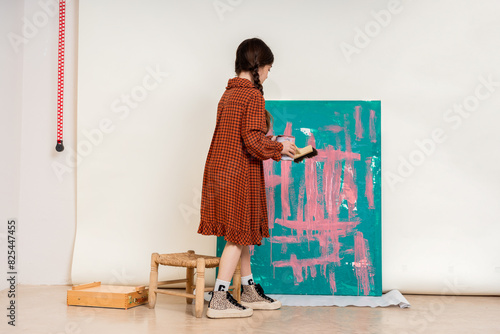 cute Artist Painting on Canvas