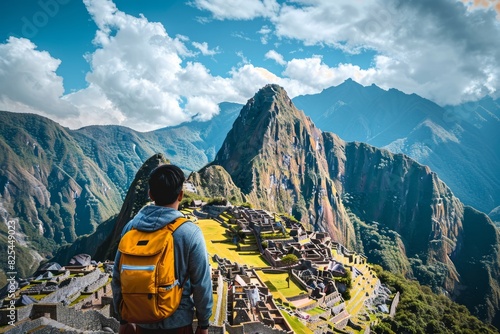 Wallpaper Mural Tourist with backpack in awe of the majestic Machu Picchu framed by Andean peaks and vivid blue skies Torontodigital.ca