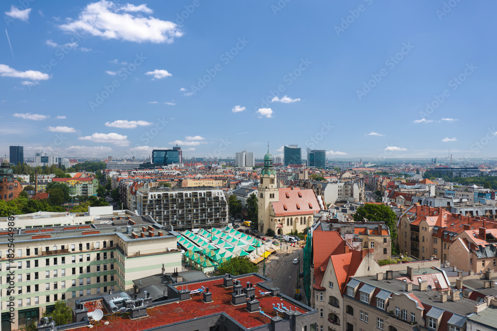 Summer skyline cityscape of district Wilda in Poznań, Poland. Wide panoramic aerial view. Church and Wilda market (Rynek Wildecki)