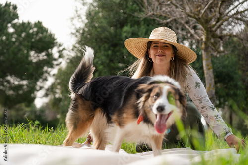 Woman enjoying outdoors with her australian shepherd dog photo