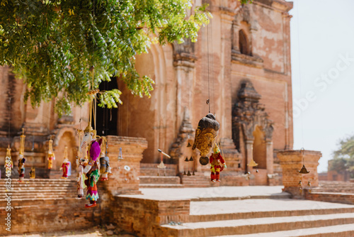 Traditional puppets hanging on tree at Bagan temple photo