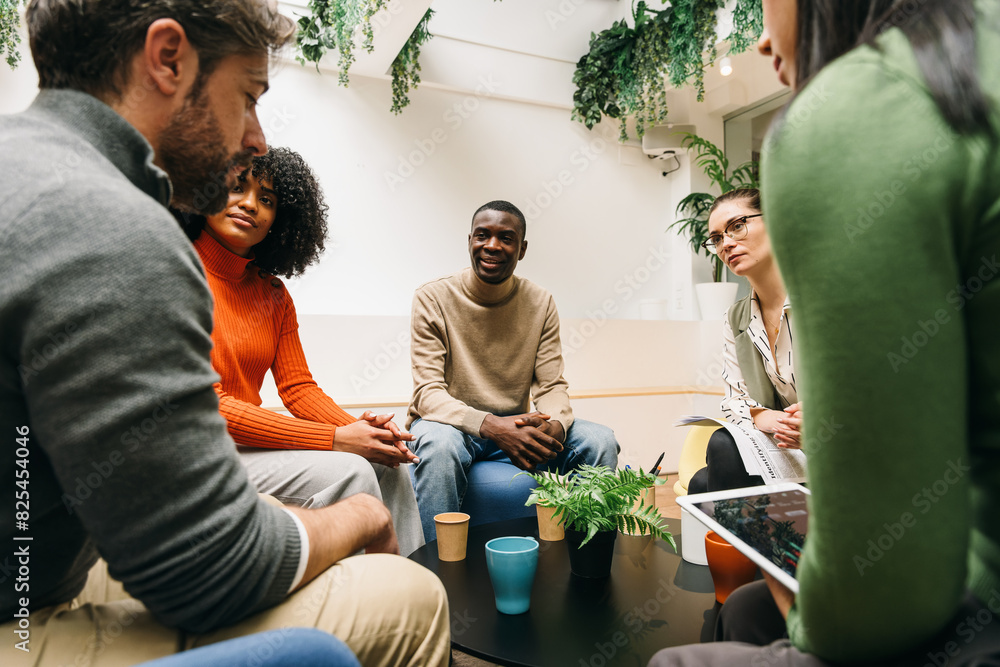 © VICTOR TORRES/Stocksy - Diverse team engaged in a collaborative meeting
