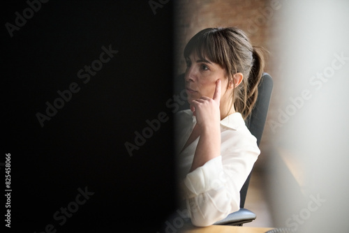 in the office behind her computer screen photo
