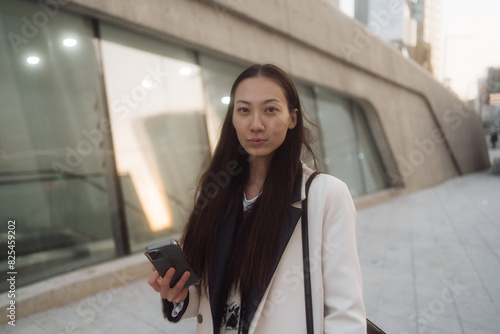 a single woman walks around a big city photo