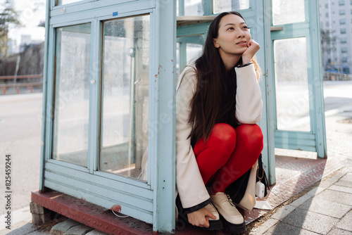 a single woman walks around a big city photo