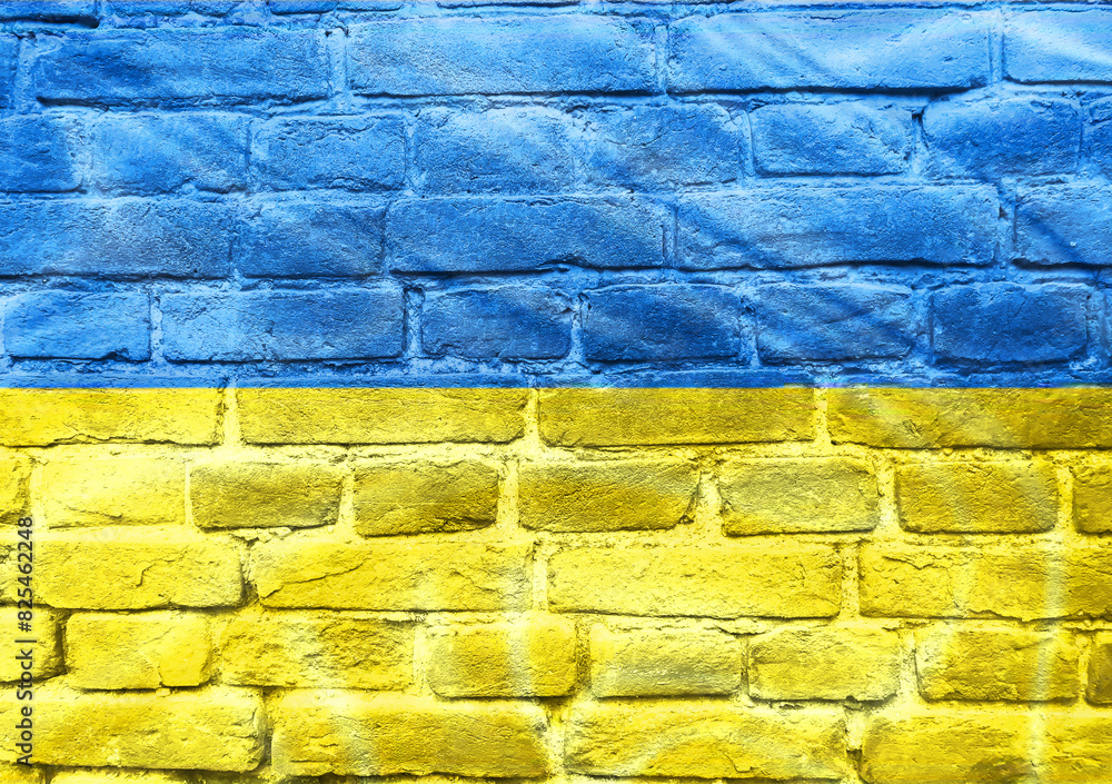 A blue and yellow flag is painted on a brick wall A blue and yellow flag is painted on a brick wall