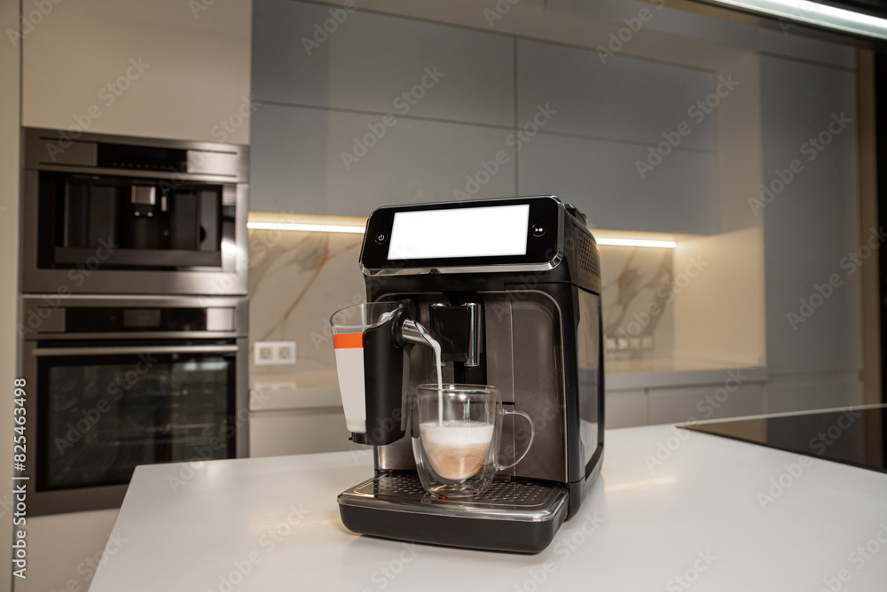 Automatic coffee machine on a table making cappuccino Automatic coffee machine on a table making cappuccino