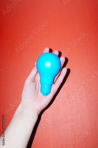 Conceptual photo of light bulb representing new idea, ideation, eureka photo