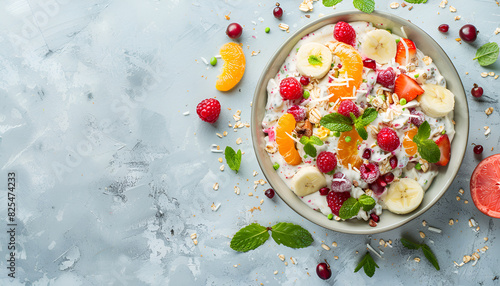 Delicious fruit salad with yogurt on light table photo