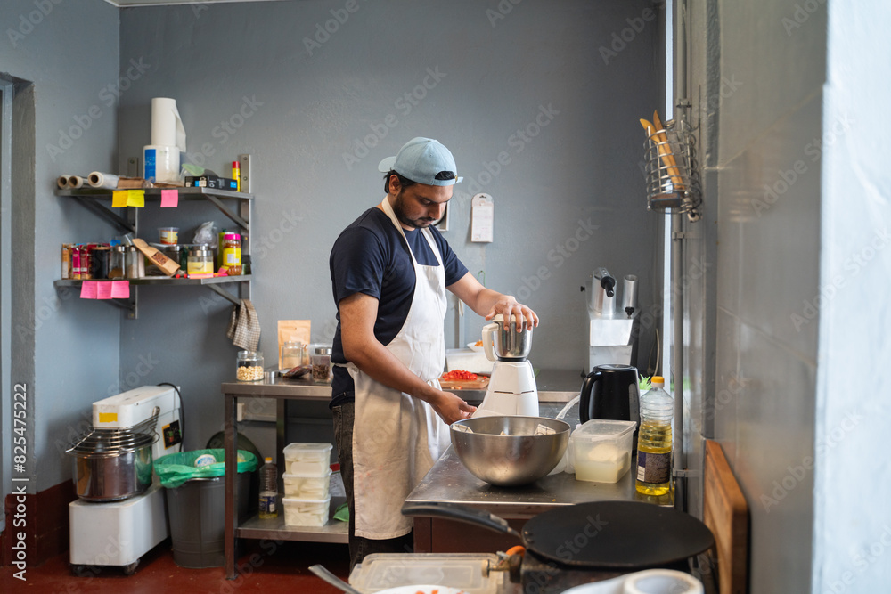 Indian Restaurant Worker Blending Spices Indian Restaurant Worker Blending Spices