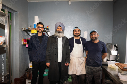 Indian Restaurant Team Candid Portrait At The Kitchen photo
