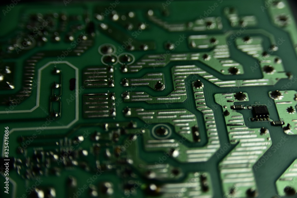 Close-up of a computer motherboard with visible circuitry and components Close-up of a computer motherboard with visible circuitry and components