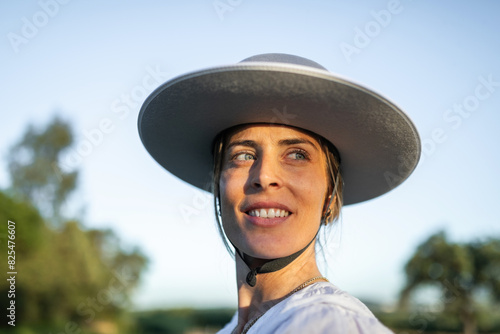 Portrait of woman wearing wide-brimmed monteria hat photo