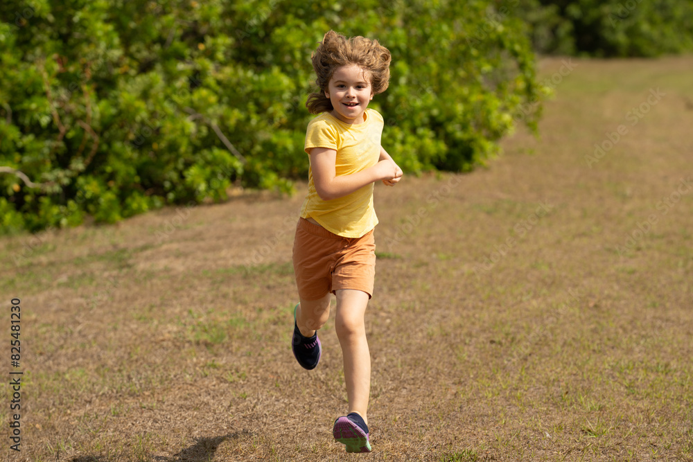 Excited Kid running in street. Amazed child enjoy run. Happy little boy running on street. Blonde cute kid run on neighborhood running road. Child boy running in park sports and run exercise for kids. Excited Kid running in street. Amazed child enjoy run. Happy little boy running on street. Blonde cute kid run on neighborhood running road. Child boy running in park sports and run exercise for kids.