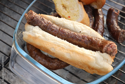 grilled sausages on the grill. Boerewors sausage roll