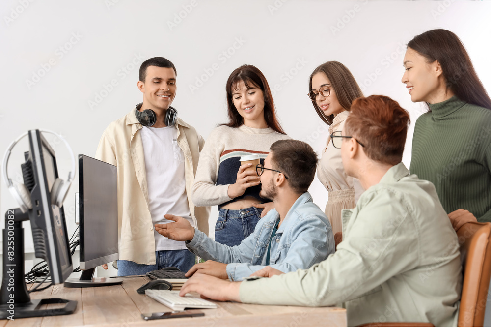 Team of young programmers working in office Team of young programmers working in office
