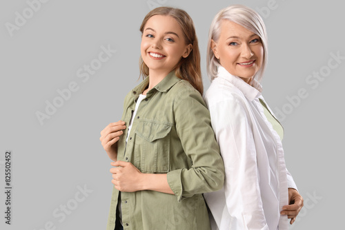 фотографія Young woman with her mother on light background