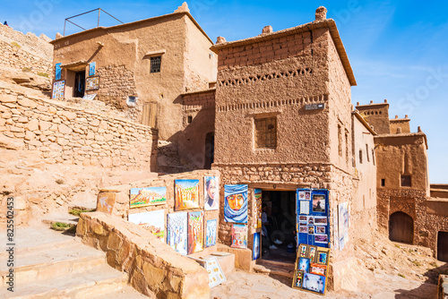 Traditional Moroccan souvenirs for sale in narrow street of Ksar Ait Ben Haddou, old Berber ancient village or kasbah, Morocco, North Africa.