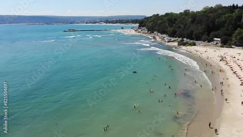 Panoramic aerial drone top view of beach, seashore, umbrellas, coastline and hotels in Varna, Bulgaria, near Golden Sands. Popular summer resort near Varna on Black sea. Summer holiday destination in 