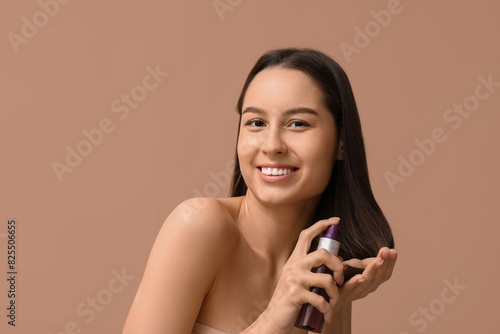 Young woman with cosmetics ...