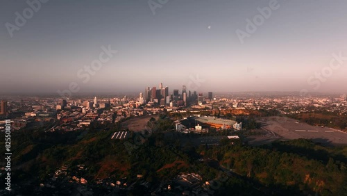 Wallpaper Mural Aerial view of Dodger stadium and skyscrapers in downtown Los Angeles during sunrise with moon in the clear sky Torontodigital.ca