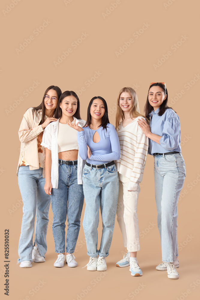 Fototapeta premium Young women on beige background. Hen Party