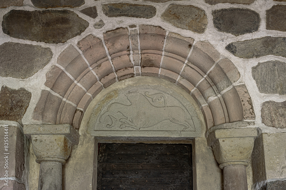 medieval sandstone doorway of two lions
