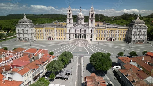 Aerial drone view approaching Convent of Mafra and lovely village houses, Portugal - UNESCO World Heritage Site photo