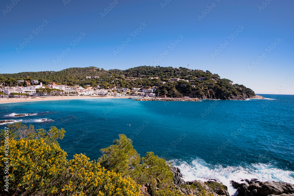 Beautiful turquoise beach in quiet Mediterranean waters in a town in Costa Brava, Catalonia Beautiful turquoise beach in quiet Mediterranean waters in a town in Costa Brava, Catalonia