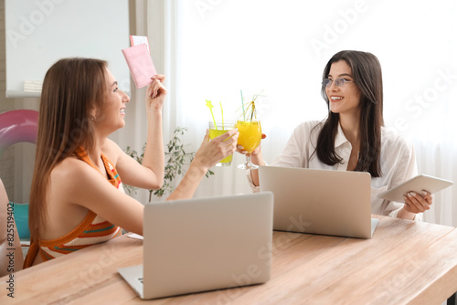 Business women with cocktai...