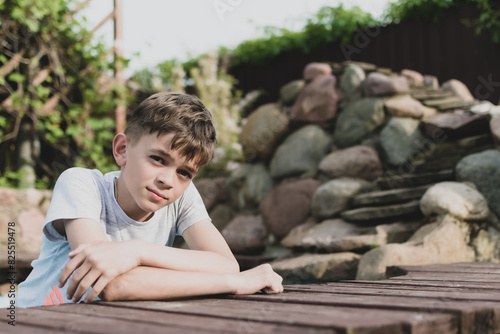 A little boy is resting on a private plot