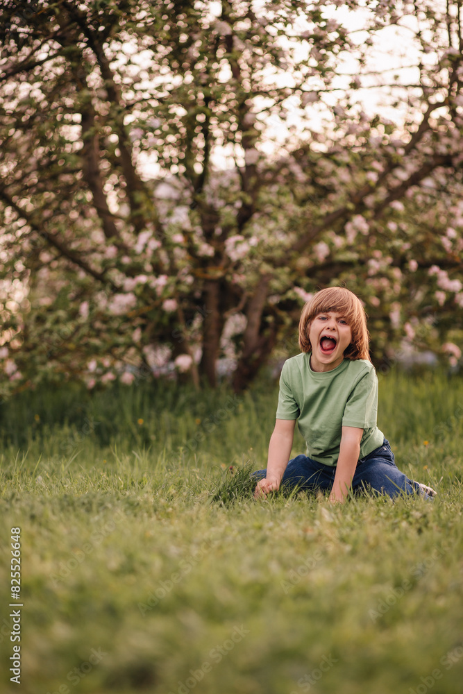 portrait of a child playing in an apple orchard in spring portrait of a child playing in an apple orchard in spring