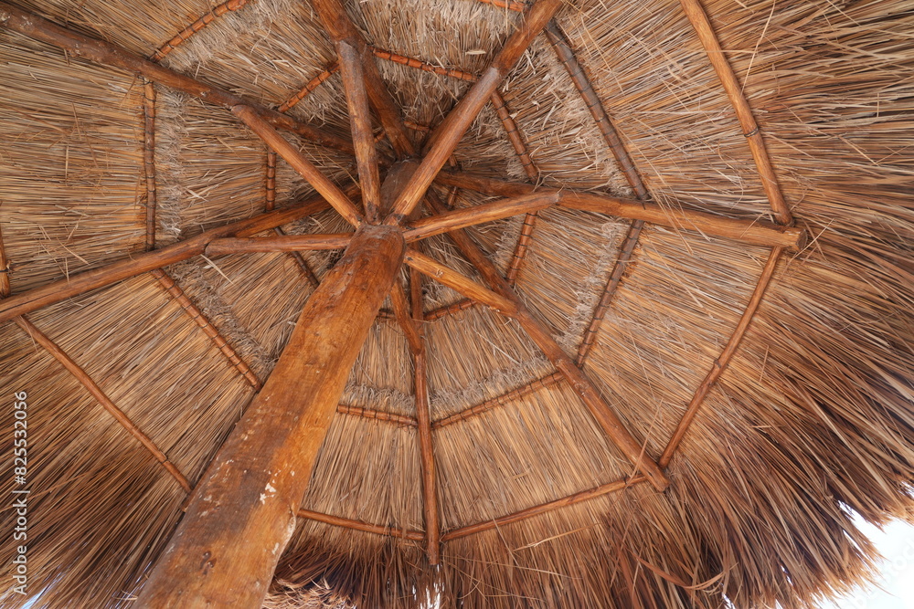 low angle view of tiki hut thatch roof 