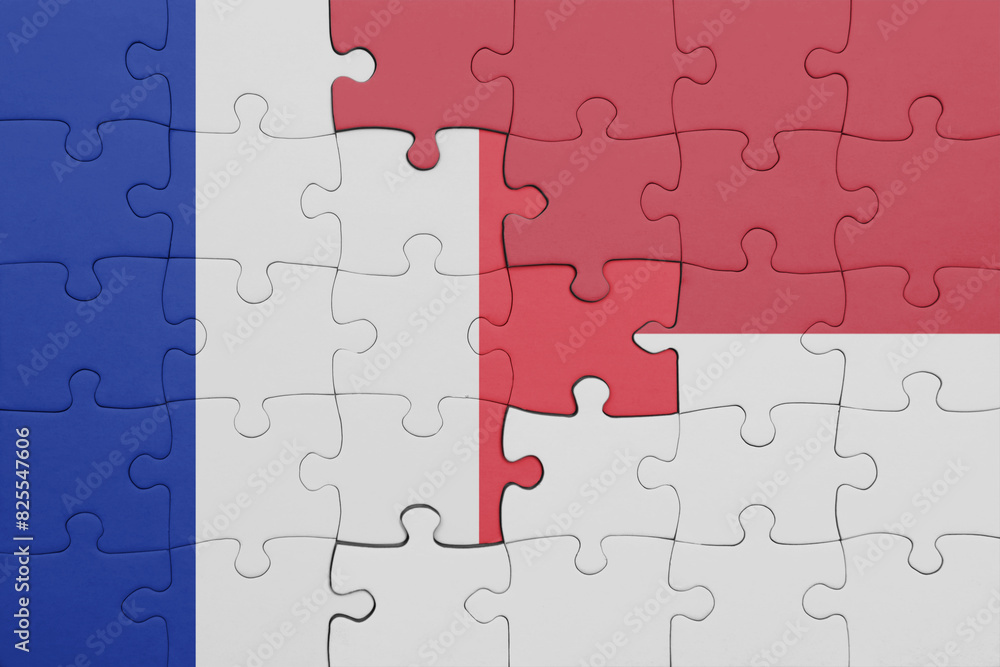puzzle with the colourful national flag of indonesia and flag of france. puzzle with the colourful national flag of indonesia and flag of france.