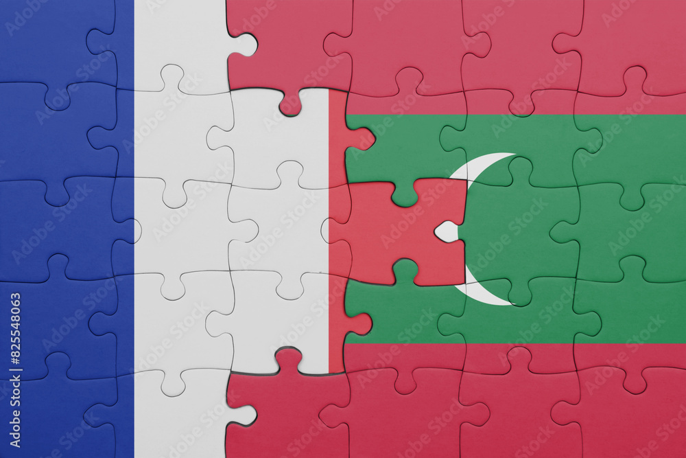 puzzle with the colourful national flag of maldives and flag of france. puzzle with the colourful national flag of maldives and flag of france.