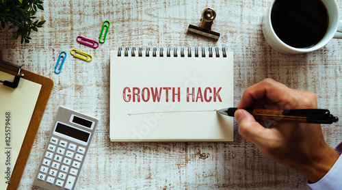 There is notebook with the word Growth Hack. It is as an eye-catching image.