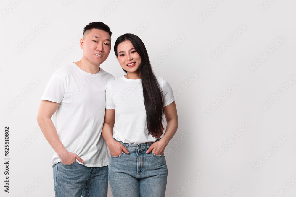 Portrait of happy couple on white background, space for text Portrait of happy couple on white background, space for text